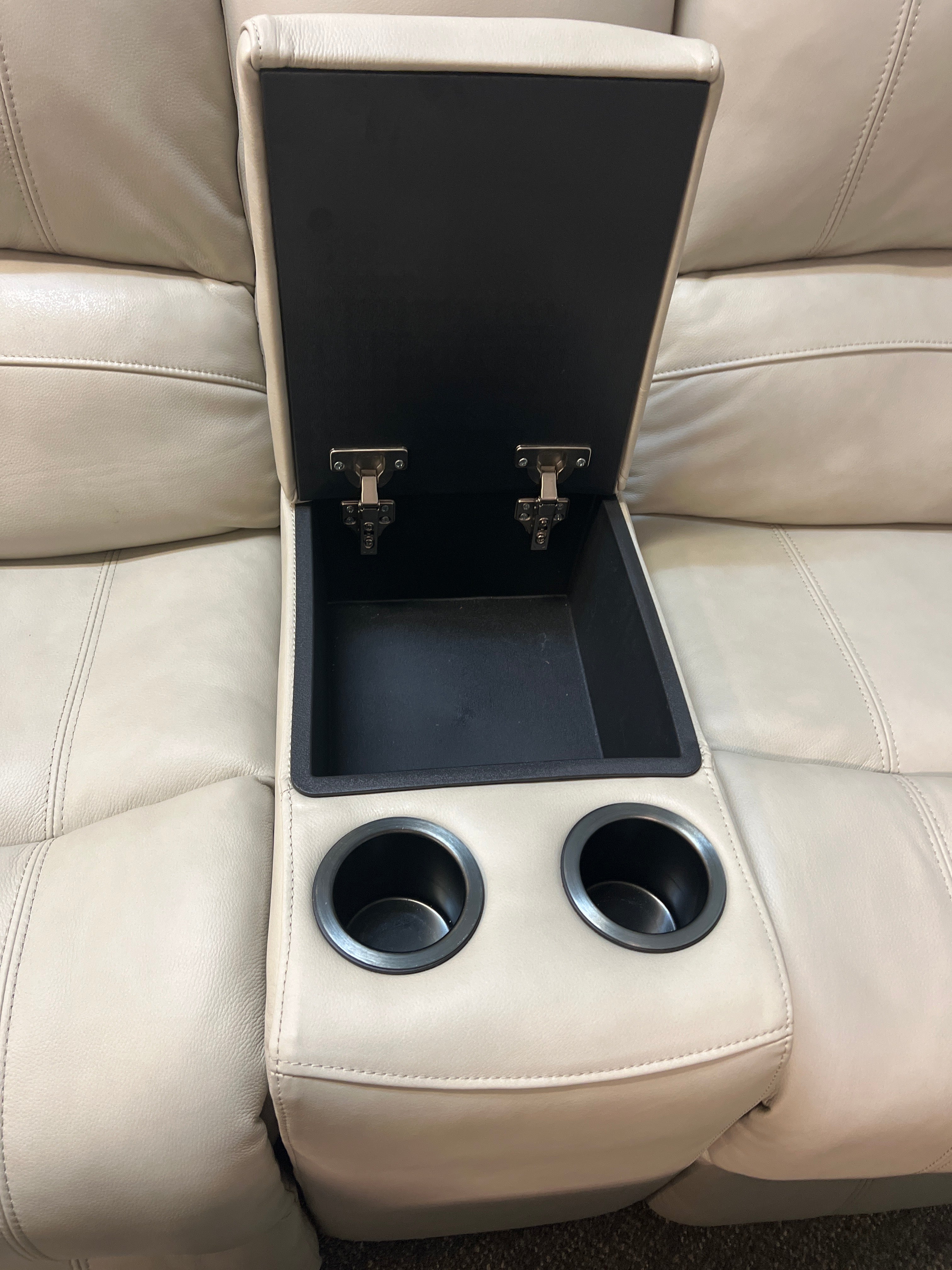 Cream Leather Reclining Sofa With Cup Holders and Center Storage